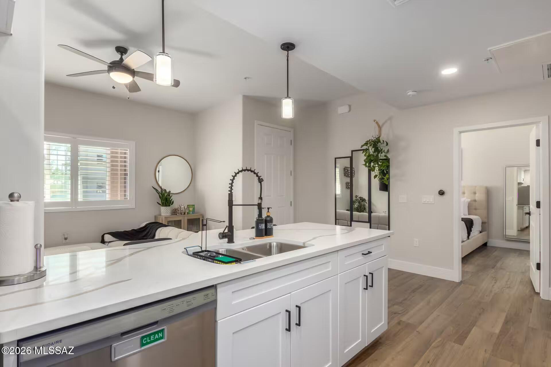 2036 East River Road, Unit 104 Tucson, AZ 85718 - Photo 7 of 23 a kitchen with counter top space and a sink