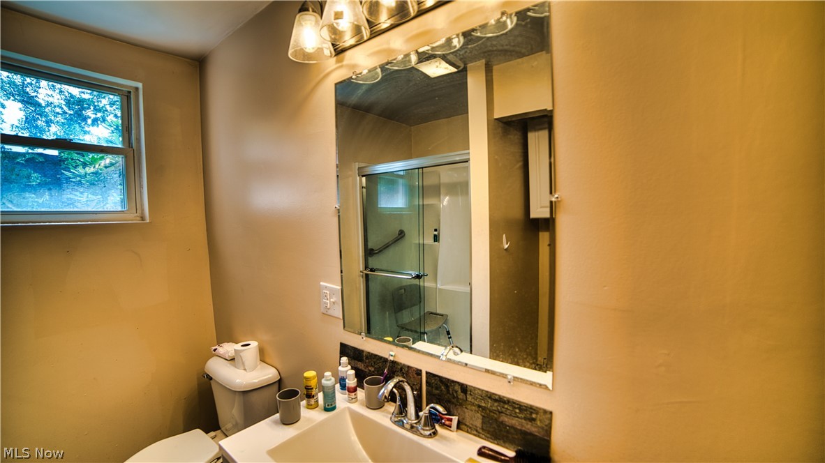160 Welton Road Conneaut, OH 44030 - Photo 4 of 16 Bathroom with sink and toilet