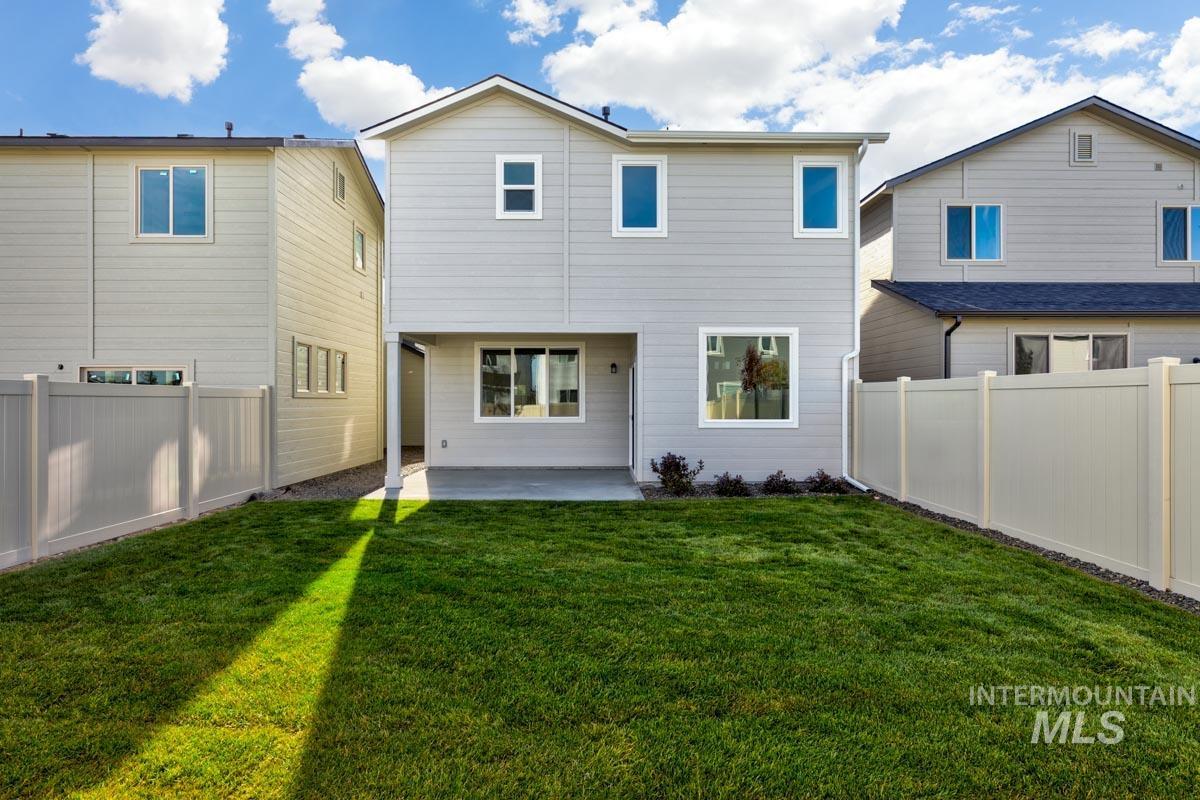 224 West Broyhill Street Meridian, ID 83642 - Photo 17 of 24 Back of house featuring a fenced backyard and a patio area