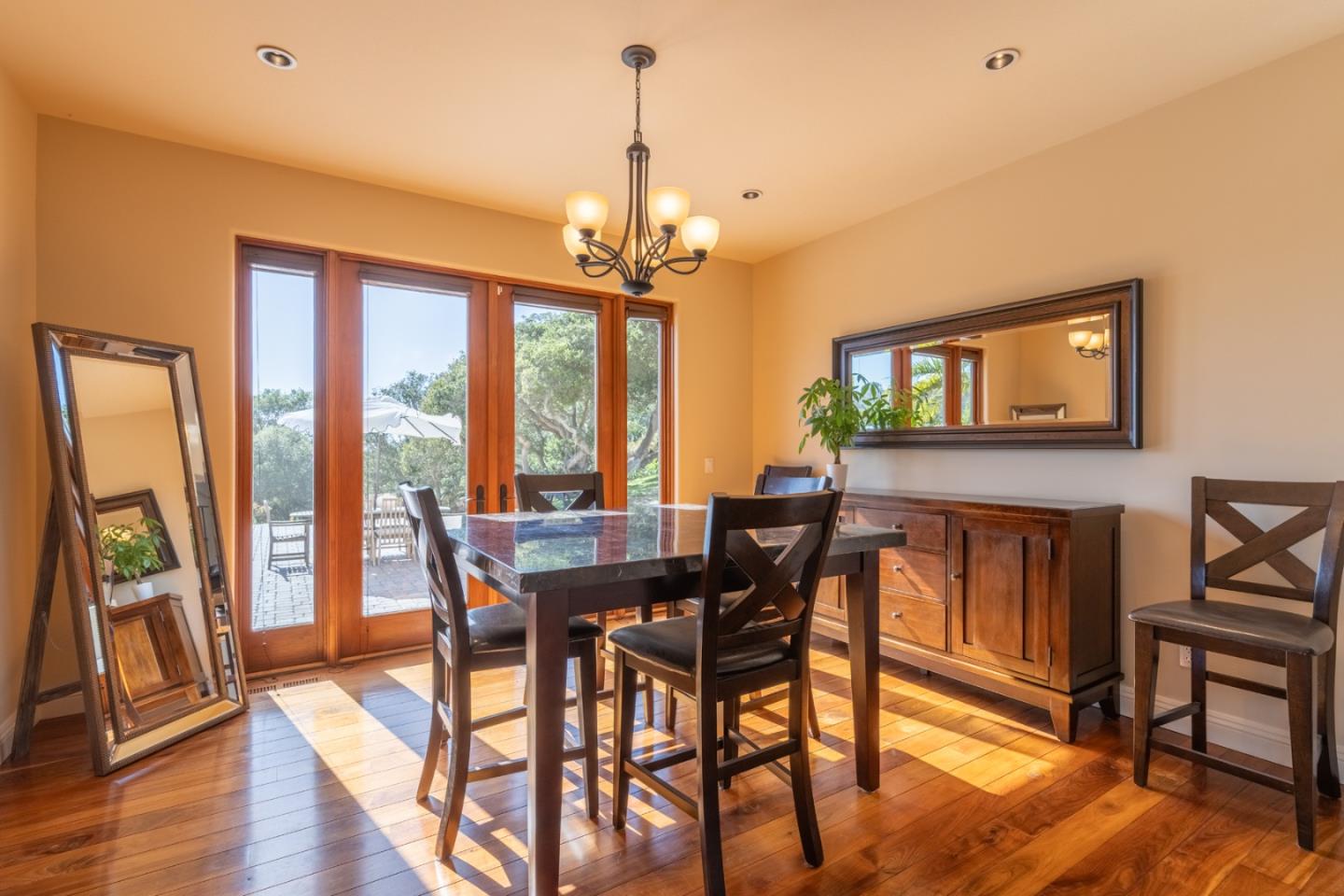 67 Tucker Road Watsonville, CA 95076 - Photo 17 of 32 a view of a dining room with furniture window and wooden floor