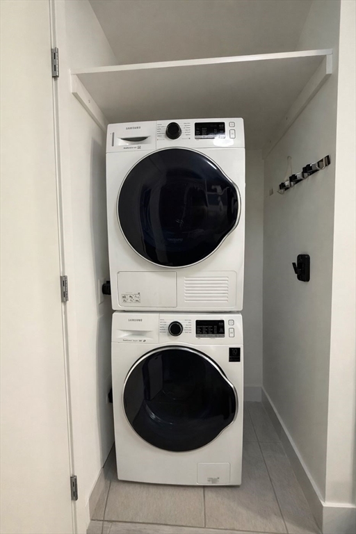 80 Fenwood Road, Unit 706 Boston, MA 02115 - Photo 16 of 33 a utility room with dryer and washer