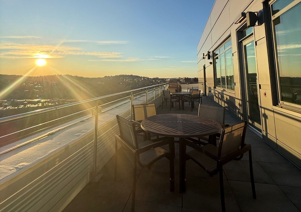 80 Fenwood Road, Unit 706 Boston, MA 02115 - Photo 22 of 33 a view of a chairs and table on the balcony