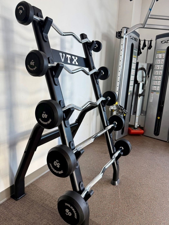 80 Fenwood Road, Unit 706 Boston, MA 02115 - Photo 25 of 33 a view of gym equipment and refrigerator in a room