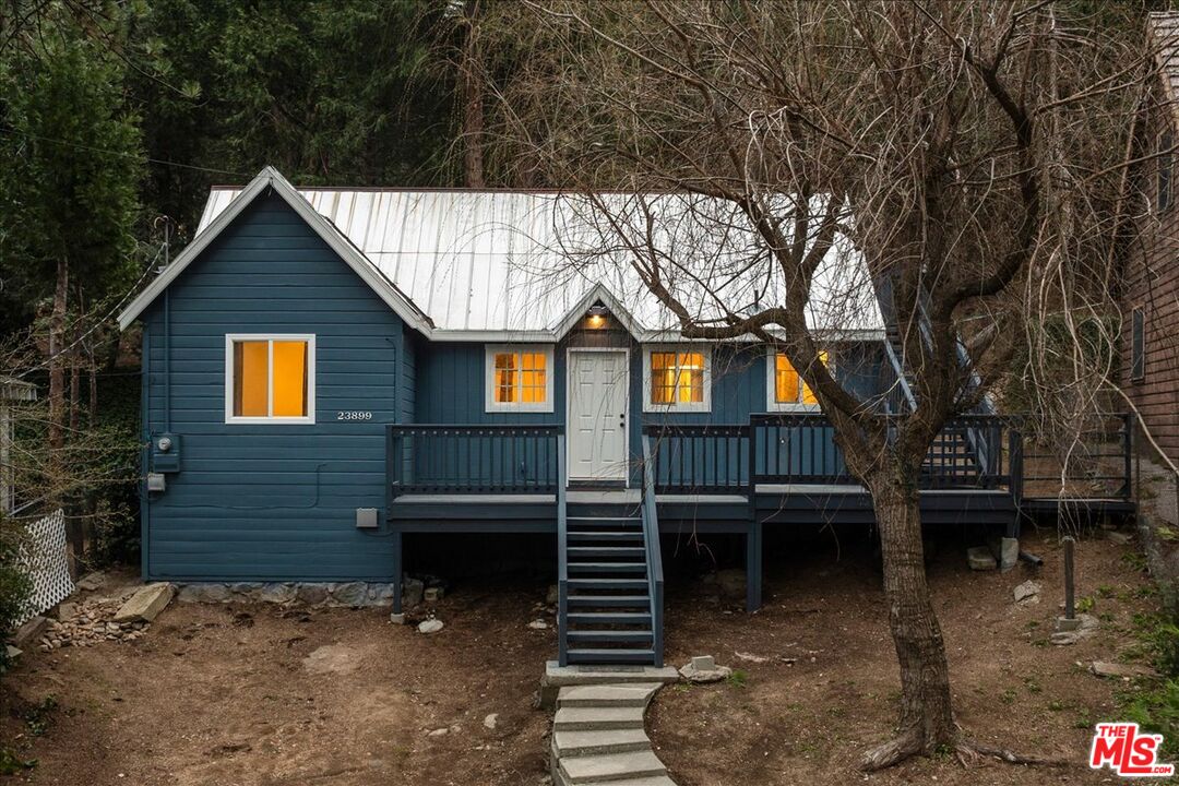 23899 Pioneer Camp Road Crestline, CA 92325 - Photo 1 of 1 a front view of a house with a yard