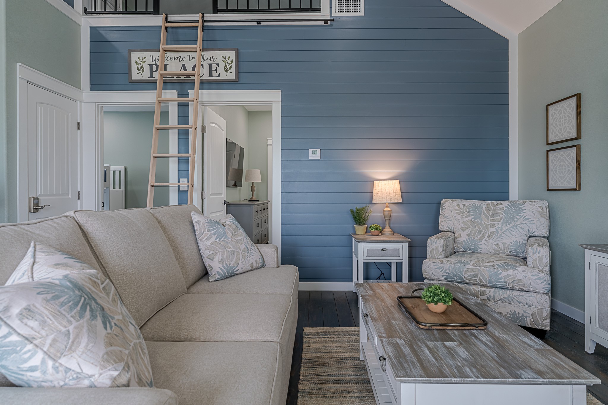 1057 Johnson Road Port Bolivar, TX 77650 - Photo 10 of 40 A ladder leads to your bonus loft above the living area, adding a fun and flexible space while the soaring ceiling keeps the room feeling open.