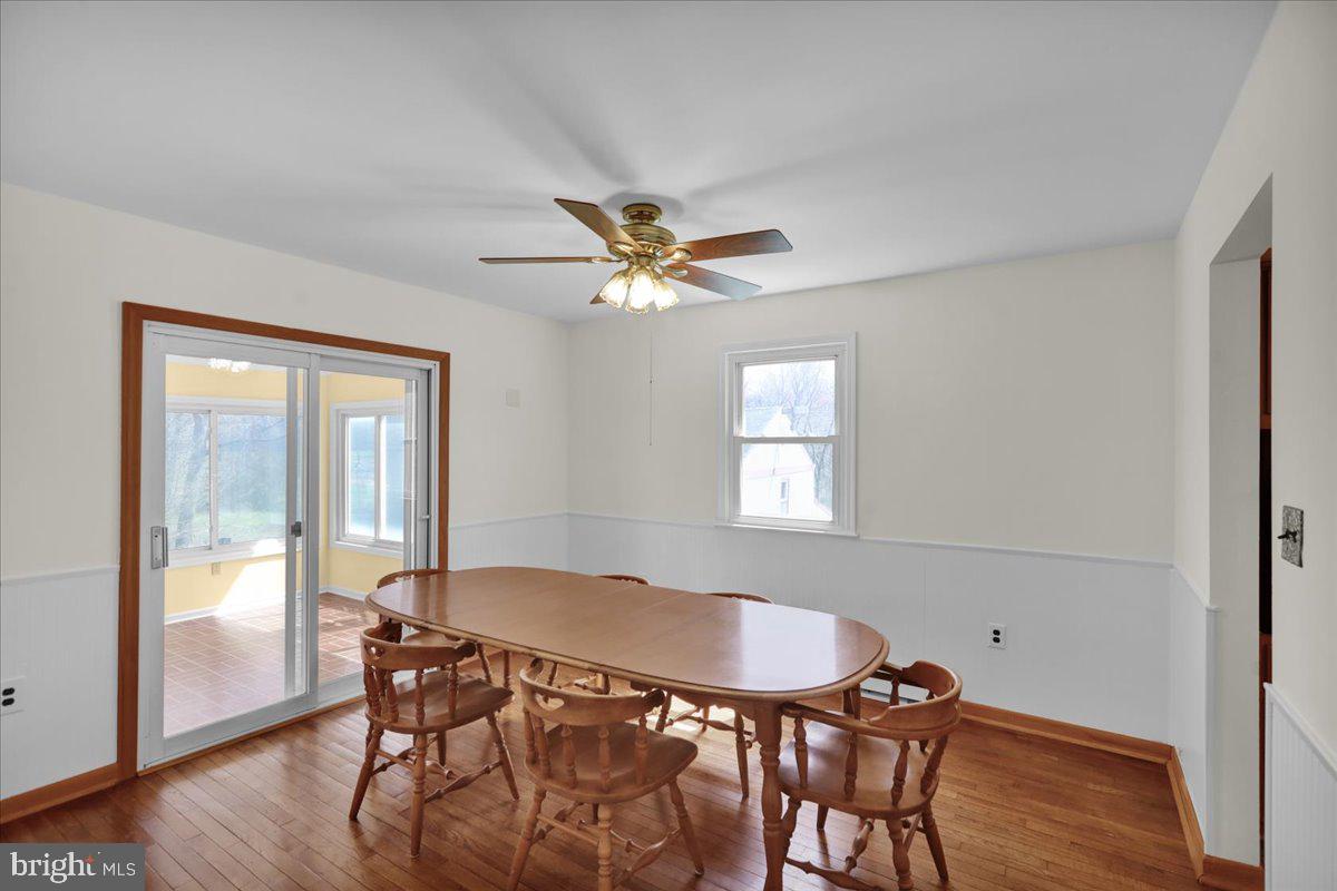 982 Fairview Road Glenmoore, PA 19343 - Photo 13 of 74 a view of a dining room with furniture and wooden floor