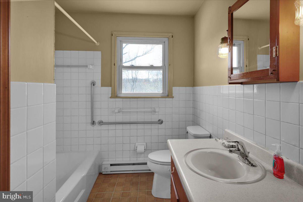 982 Fairview Road Glenmoore, PA 19343 - Photo 25 of 74 a bathroom with a sink and a bathtub