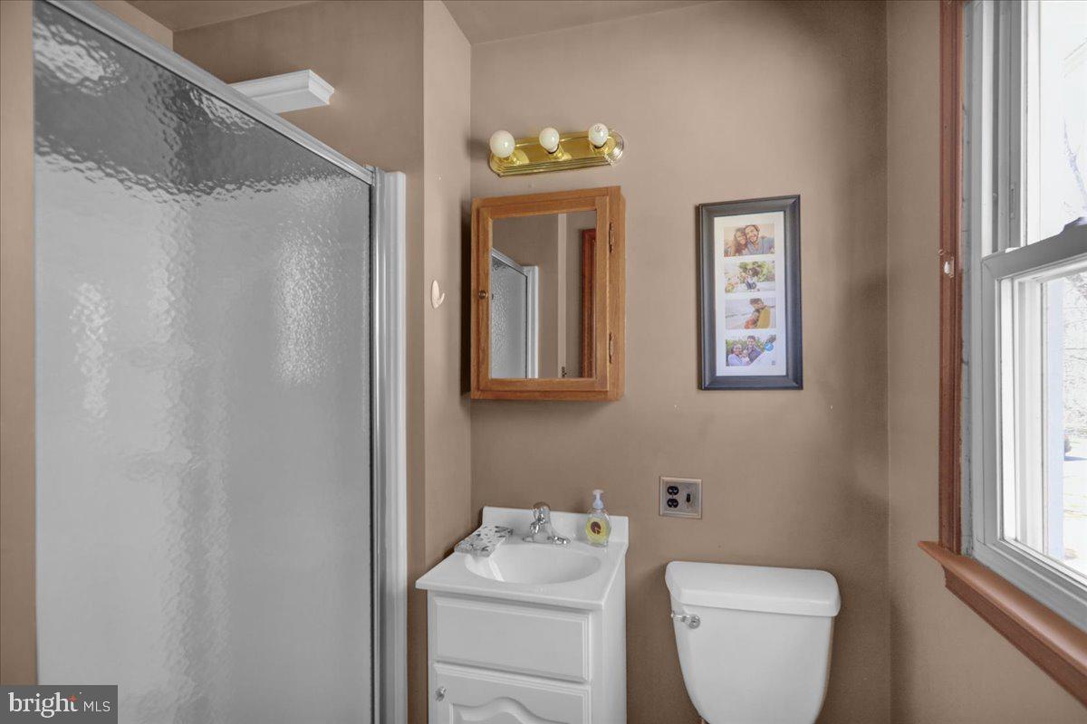 982 Fairview Road Glenmoore, PA 19343 - Photo 28 of 74 a bathroom with a toilet sink and mirror