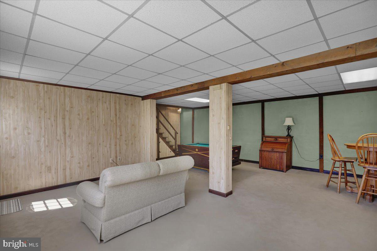 982 Fairview Road Glenmoore, PA 19343 - Photo 37 of 74 a living room with furniture and a large window
