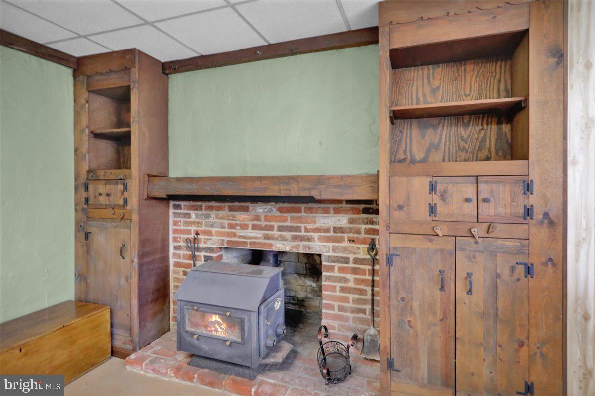 982 Fairview Road Glenmoore, PA 19343 - Photo 39 of 74 a living room with furniture and a fireplace
