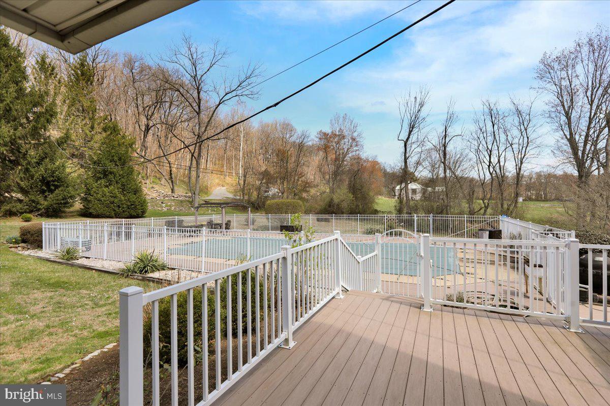 982 Fairview Road Glenmoore, PA 19343 - Photo 41 of 74 a view of balcony with wooden floor and fence