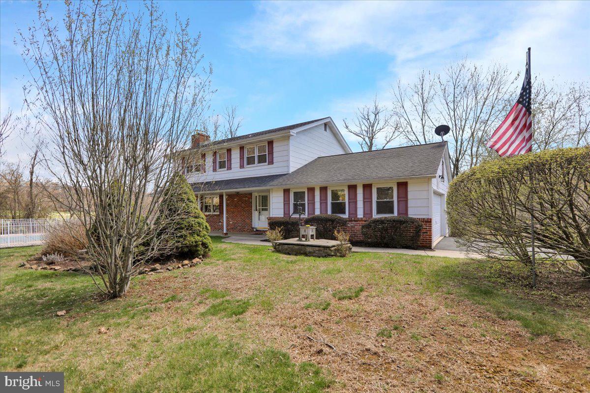 982 Fairview Road Glenmoore, PA 19343 - Photo 8 of 74 a front view of a house with yard porch and furniture