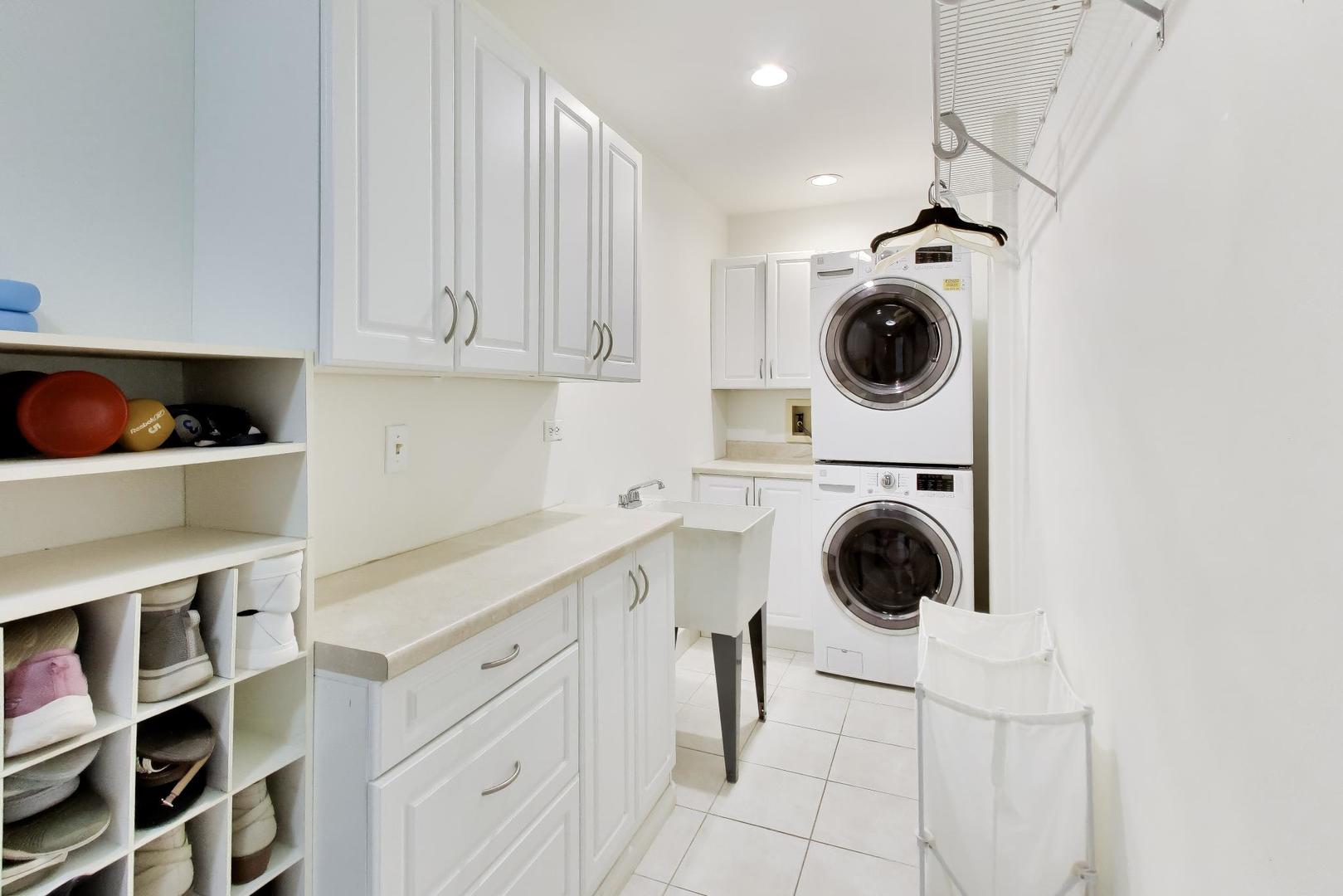 1528 Sequoia Road Naperville, IL 60540 - Photo 14 of 34 a utility room with sink dryer and washer