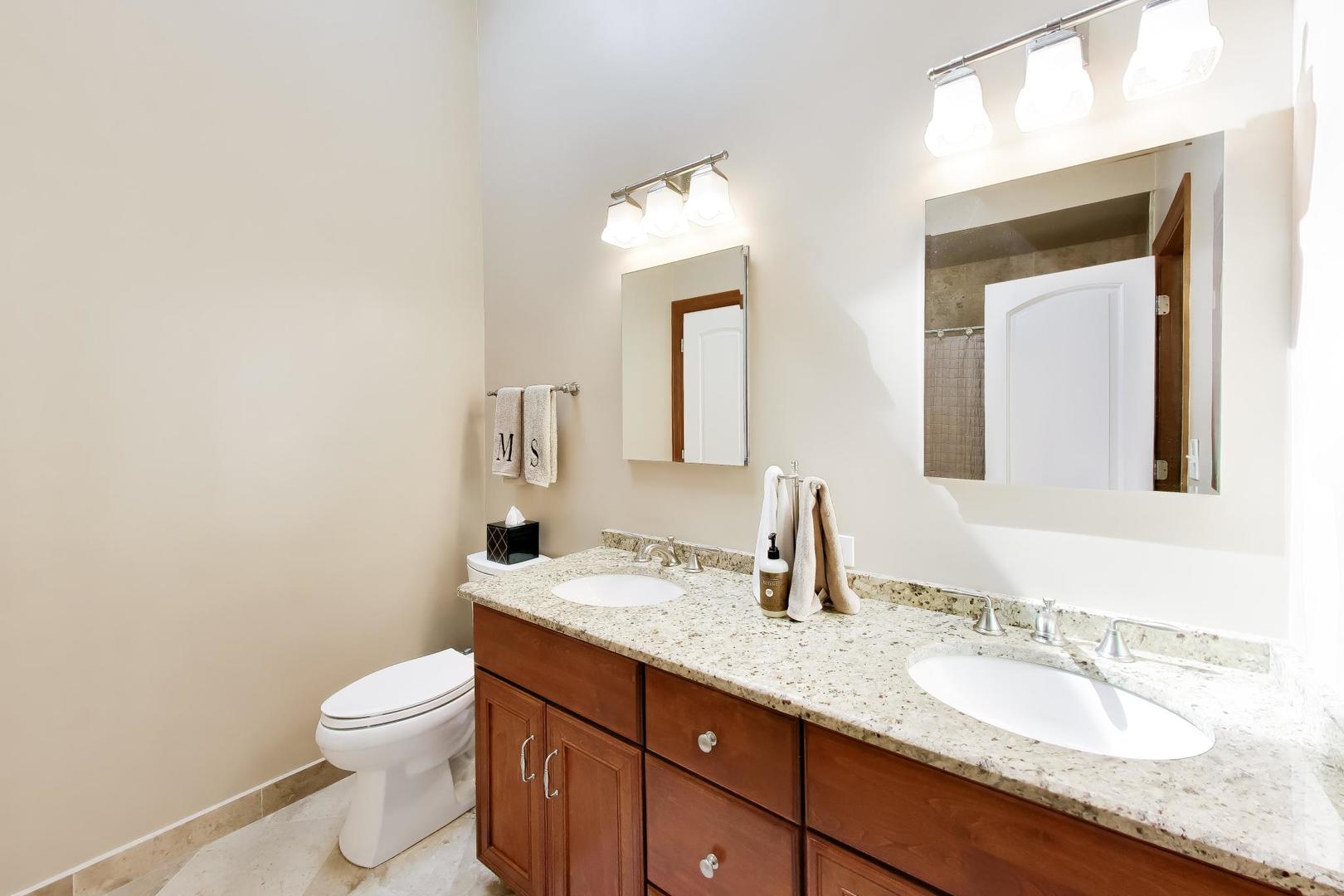 1528 Sequoia Road Naperville, IL 60540 - Photo 21 of 34 a bathroom with a granite countertop toilet sink and mirror