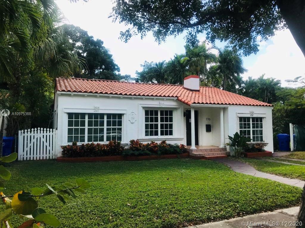a view of a house with garden and yard