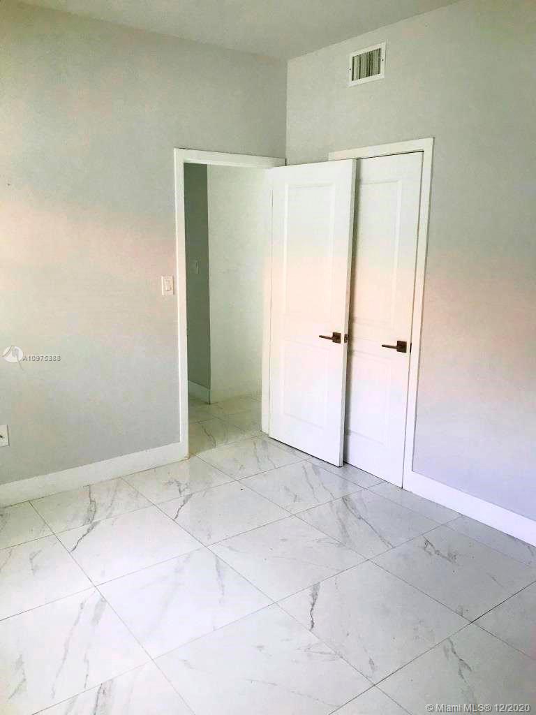 770 Northeast 77th Street Miami, FL 33138 - Photo 12 of 20 an empty room with closet area