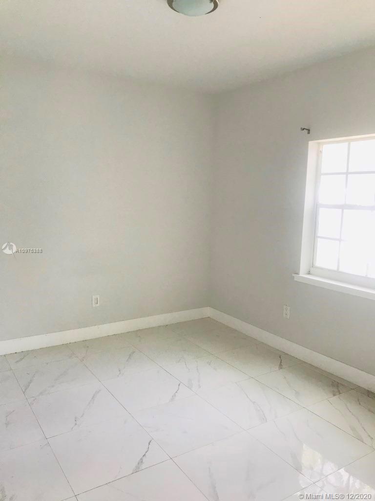 770 Northeast 77th Street Miami, FL 33138 - Photo 13 of 20 an empty room with a window