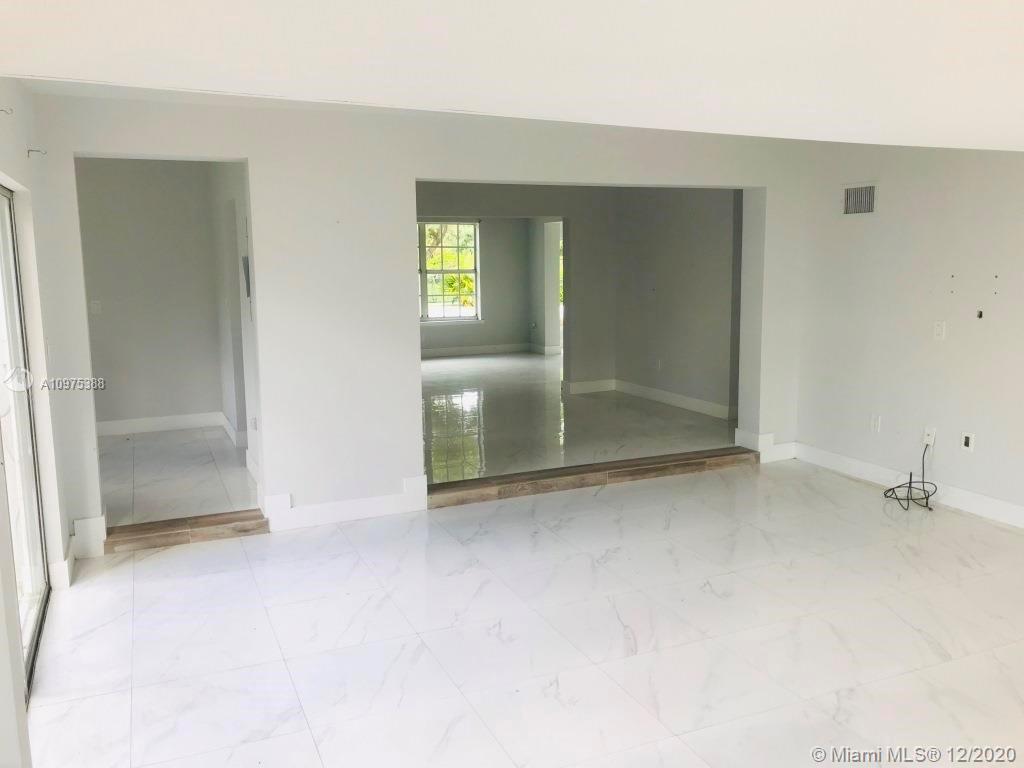 770 Northeast 77th Street Miami, FL 33138 - Photo 8 of 20 an empty room with windows