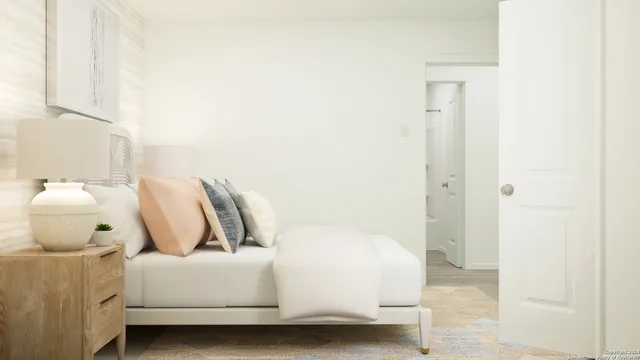 a bedroom with a bed and a mirror