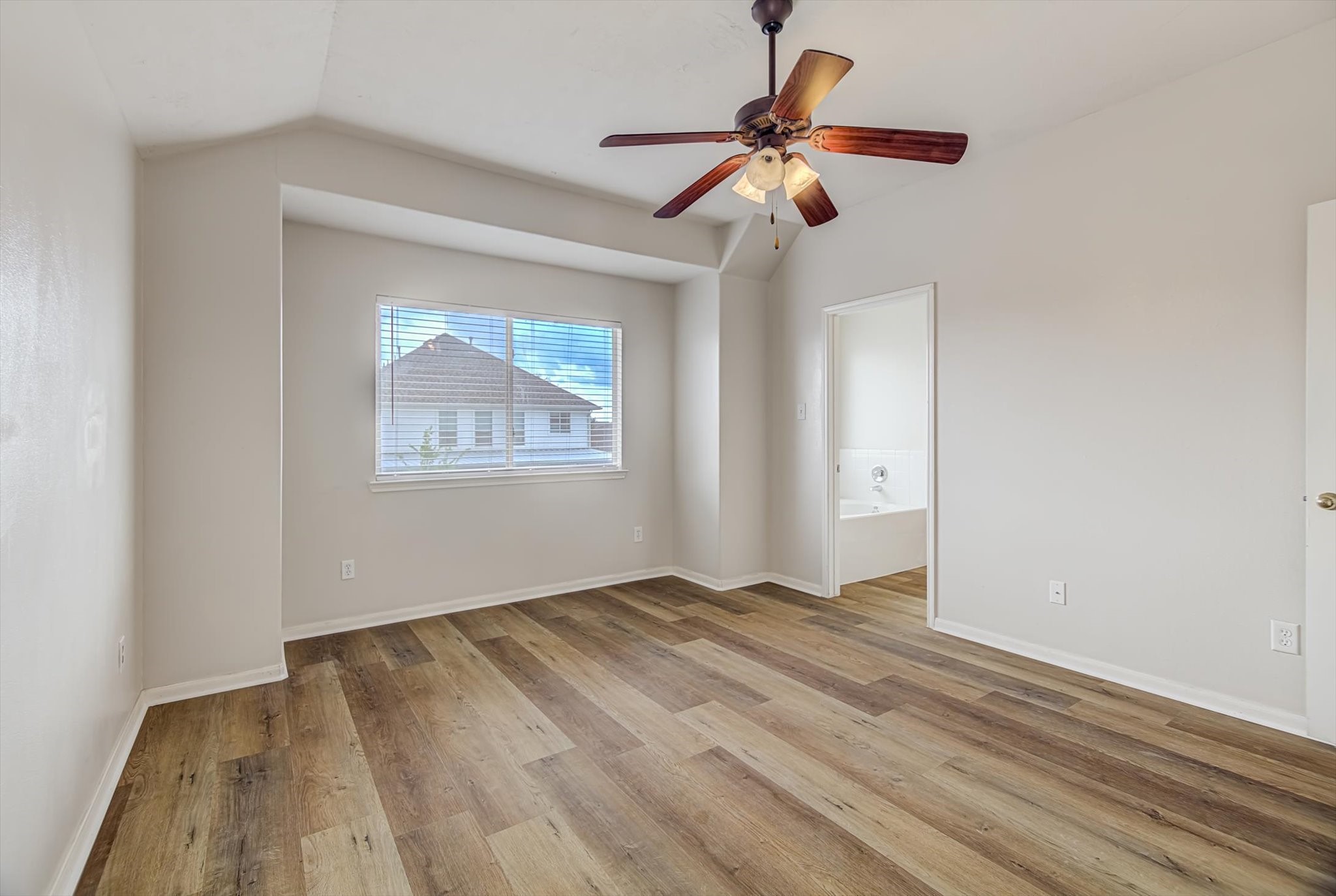 13983 Maximos Drive Houston, TX 77083 - Photo 18 of 34 a view of an empty room with a window
