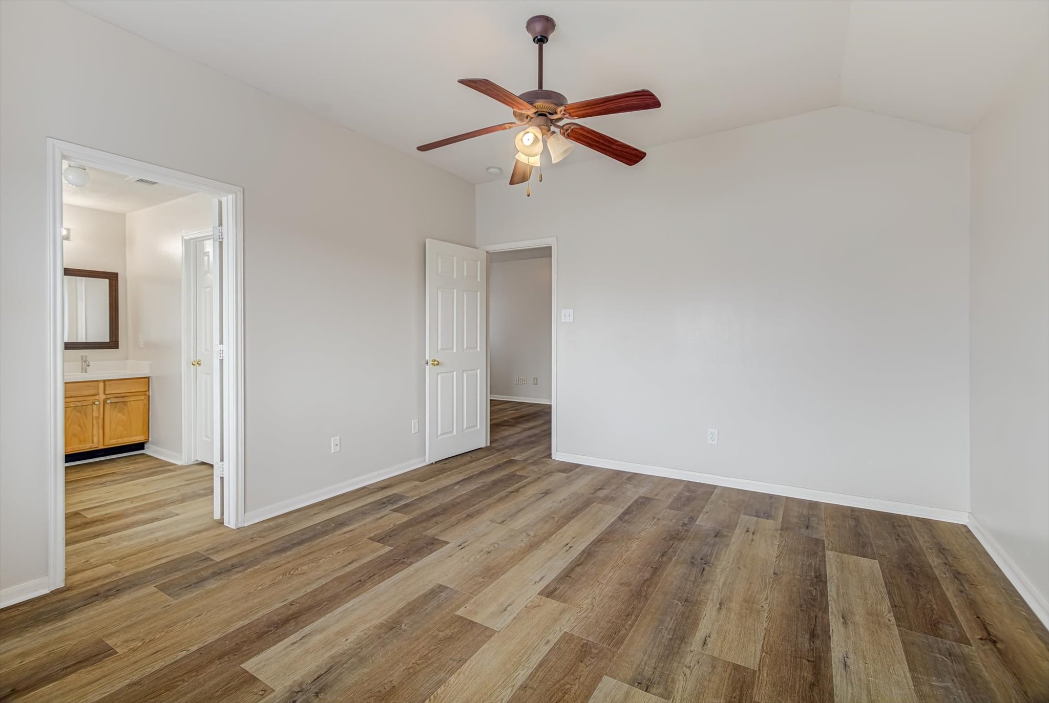 13983 Maximos Drive Houston, TX 77083 - Photo 19 of 34 a view of an empty room and wooden floor