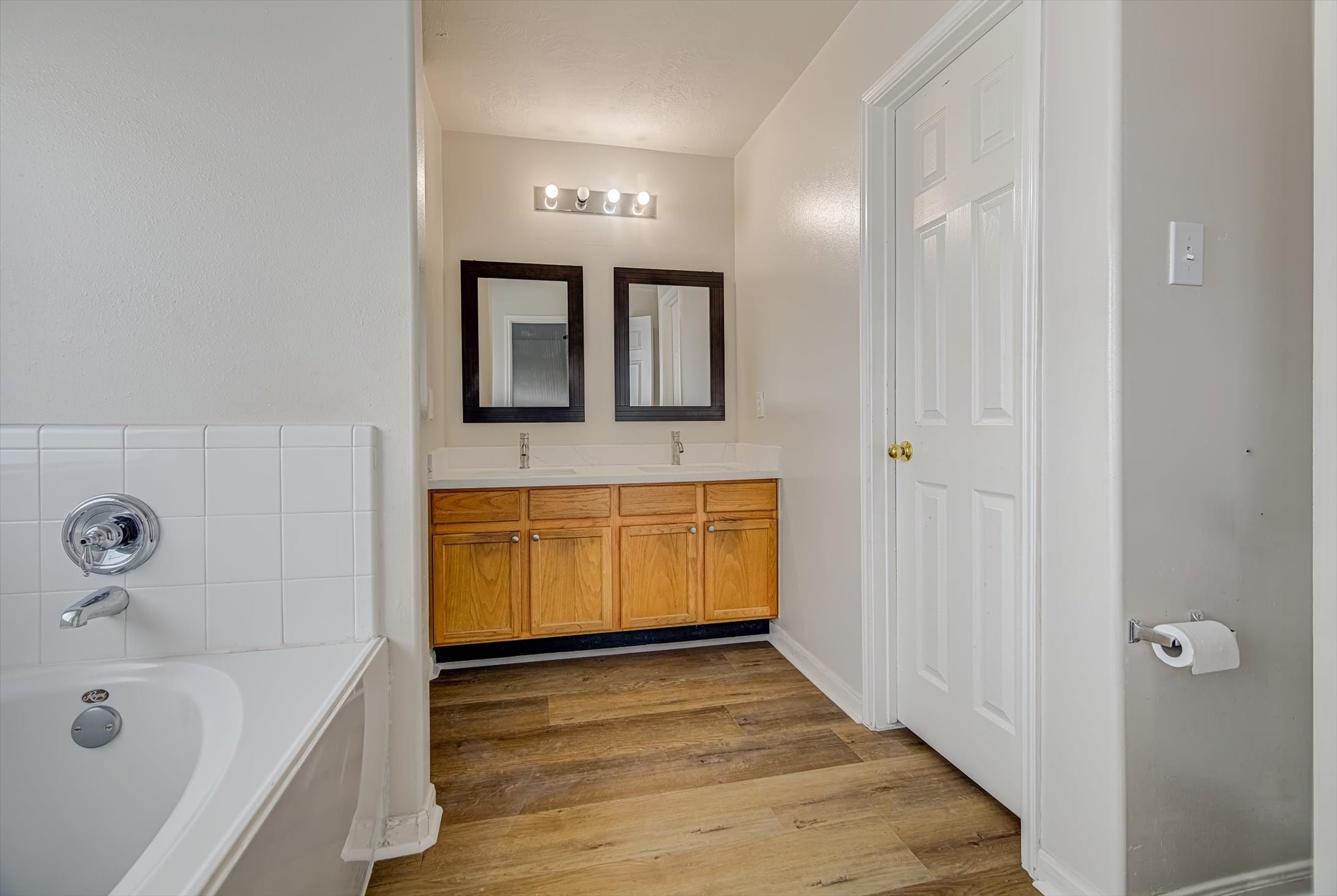 13983 Maximos Drive Houston, TX 77083 - Photo 21 of 34 a bathroom with a tub and a sink