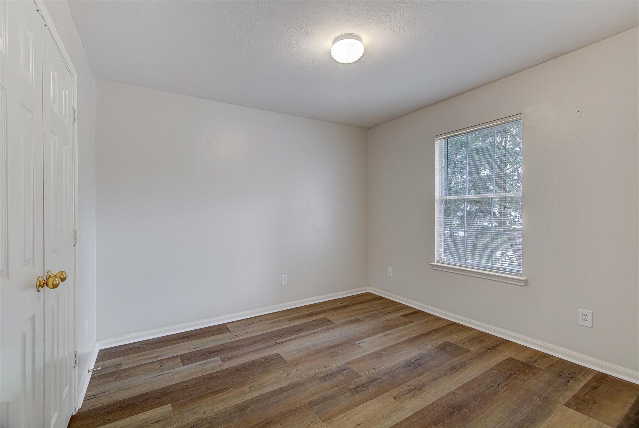 13983 Maximos Drive Houston, TX 77083 - Photo 25 of 34 an empty room with a window