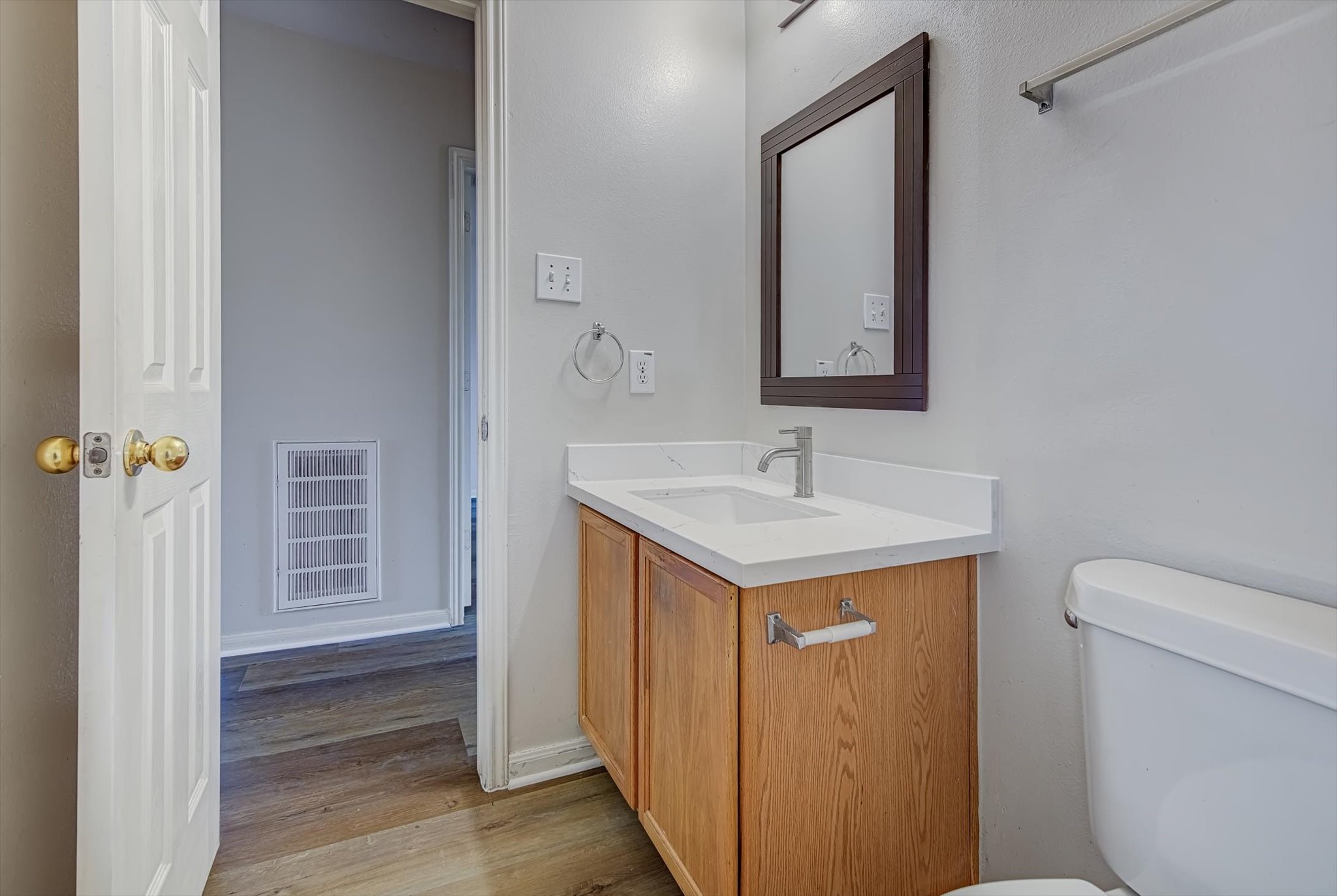 13983 Maximos Drive Houston, TX 77083 - Photo 28 of 34 a bathroom with a sink a toilet and mirror