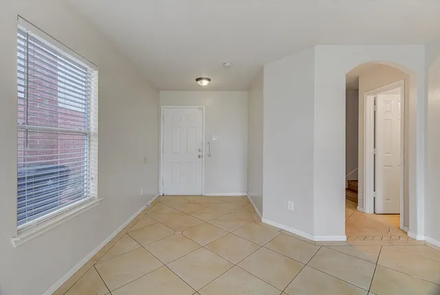 a view of an empty room and window