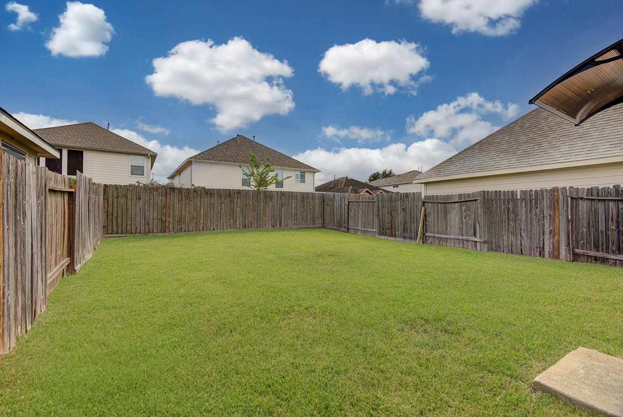 13983 Maximos Drive Houston, TX 77083 - Photo 33 of 34 a view of a backyard with a slide