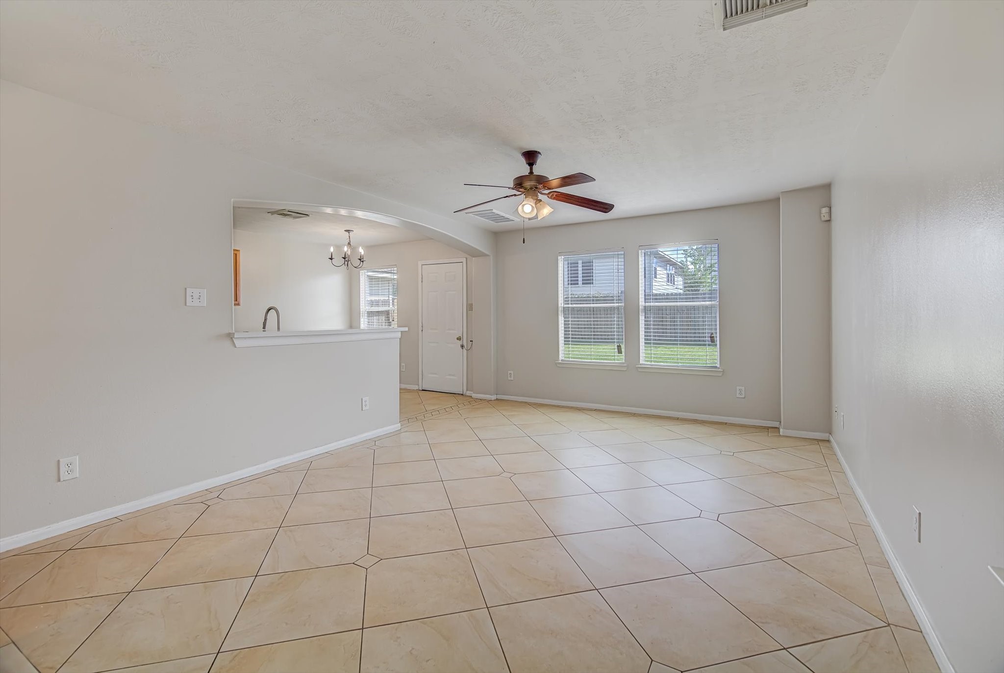 13983 Maximos Drive Houston, TX 77083 - Photo 5 of 34 a view of an empty room with a window