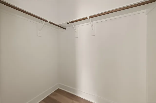 a view of an empty walk in closet