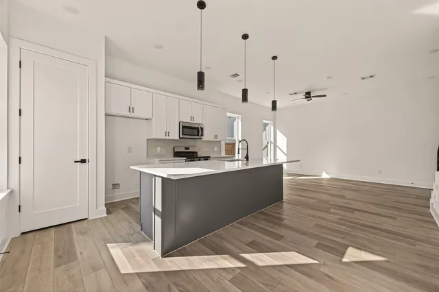 a view of kitchen with wooden floor