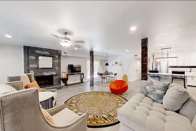 a living room with furniture and a fireplace