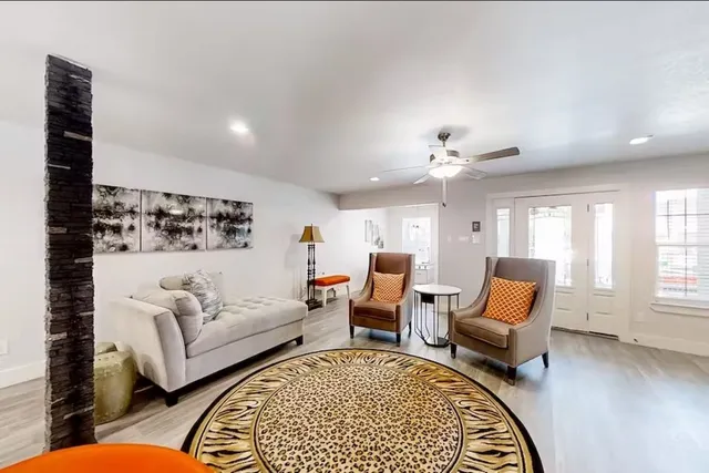 a living room with furniture and a rug