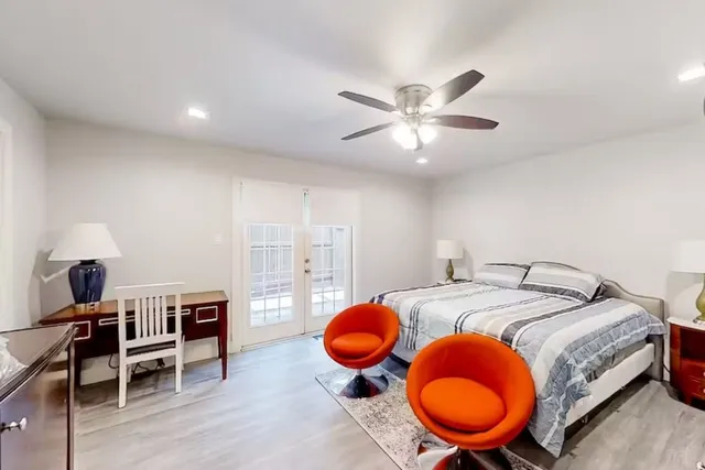 a bed room with a bed and a chandelier