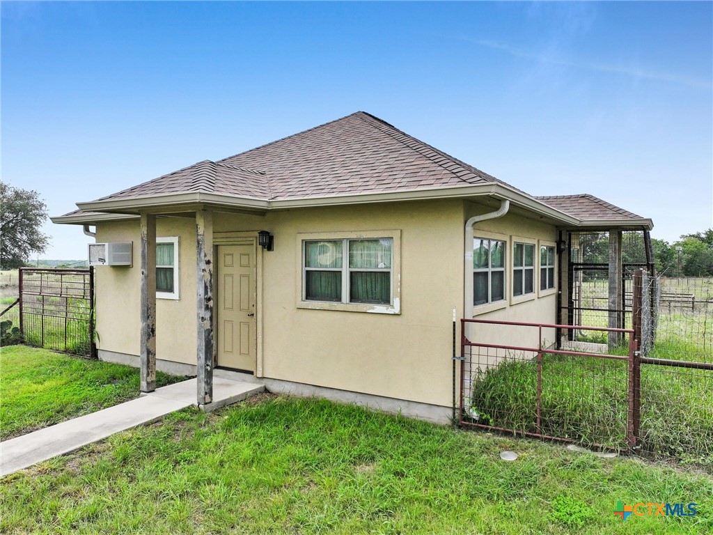 301 County Road 253 Bertram, TX 78605 - Photo 21 of 28 a front view of a house with a yard