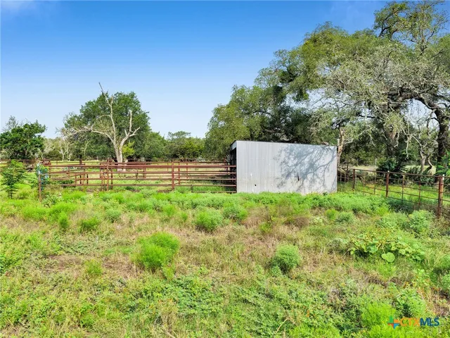 a view of a field with an outdoor space