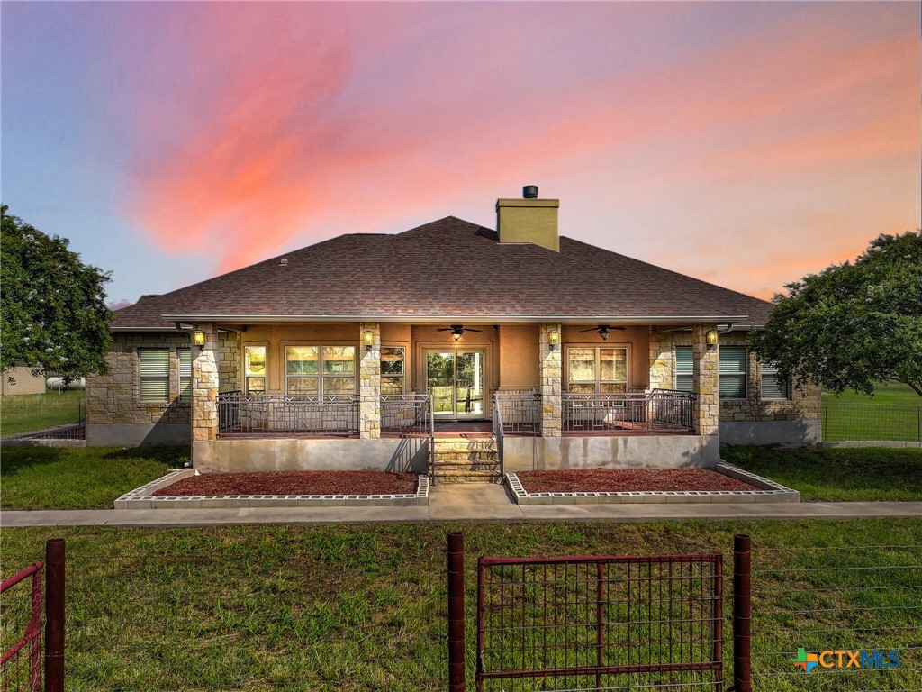 301 County Road 253 Bertram, TX 78605 - Photo 4 of 28 a front view of a house with garden