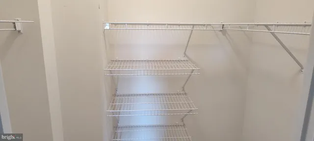 a bathroom with a granite countertop toilet and a shower