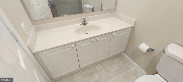 a living room with furniture a large window and a rug