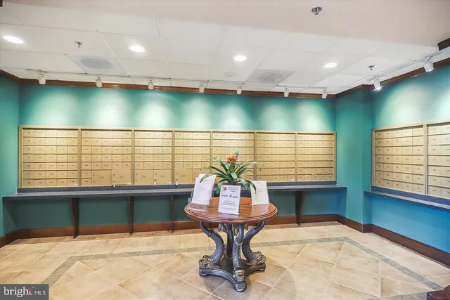 a view of hallway with furniture and a rug