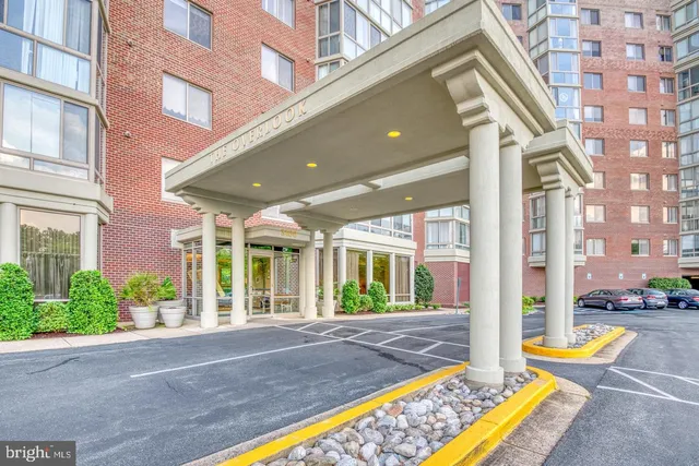 a room with pool table and windows