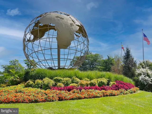 a view of a yard with swimming pool and green space