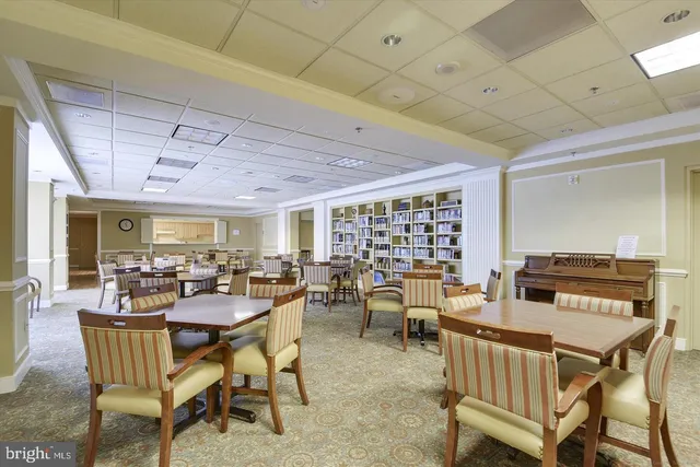 a view of balcony with a dining table and chairs
