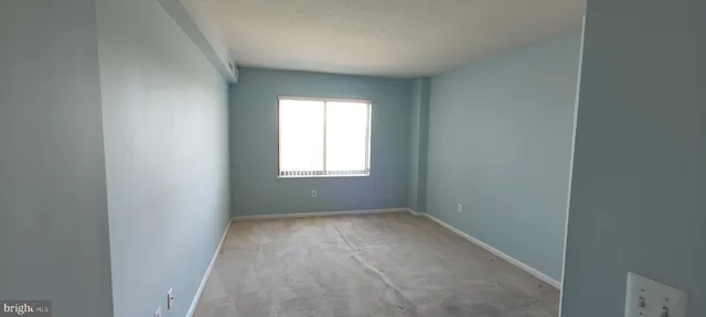 a view of hallway with closet