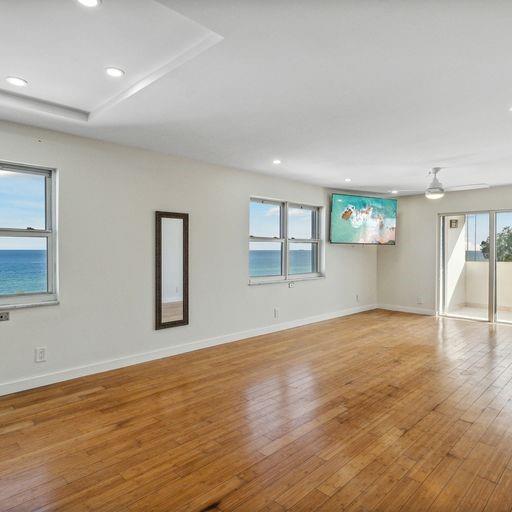 320 South Surf Road, Unit 601 Hollywood, FL 33019 - Photo 8 of 19 a view of an empty room with wooden floor and a window