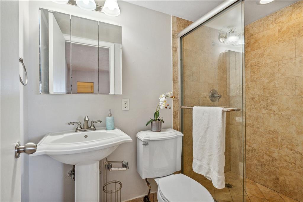 320 South Surf Road, Unit 601 Hollywood, FL 33019 - Photo 9 of 19 a bathroom with a sink mirror toilet and shower