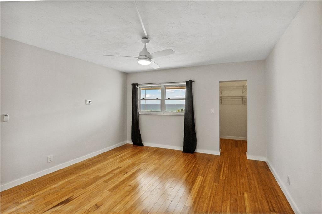 320 South Surf Road, Unit 601 Hollywood, FL 33019 - Photo 10 of 19 a view of an empty room with wooden floor