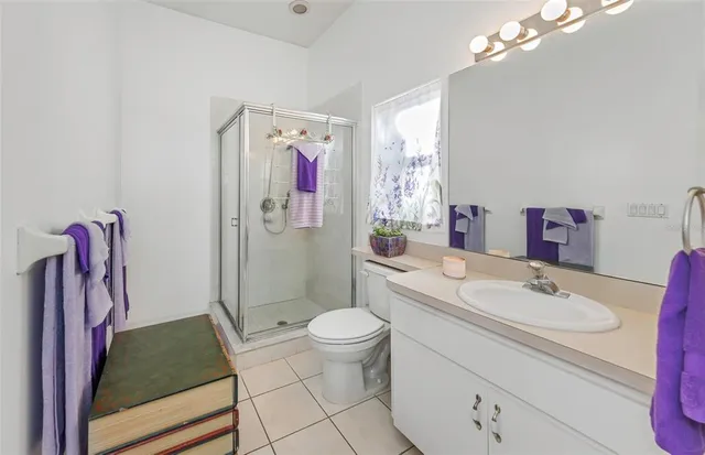 a bathroom with a bath tub with a shower